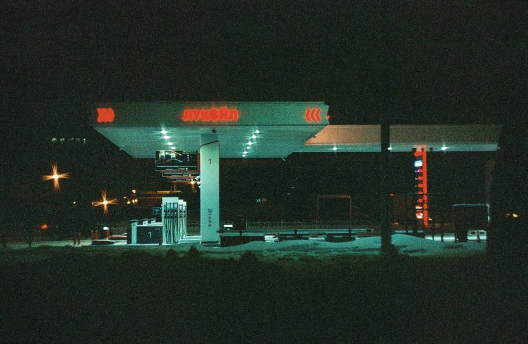 Atmospheric night view of an illuminated gas station in Saint Petersburg, Russia.