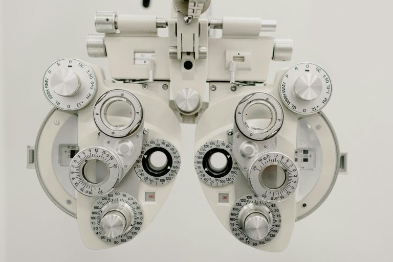 Close-up of a phoropter used in an eye examination in an optometry clinic.
