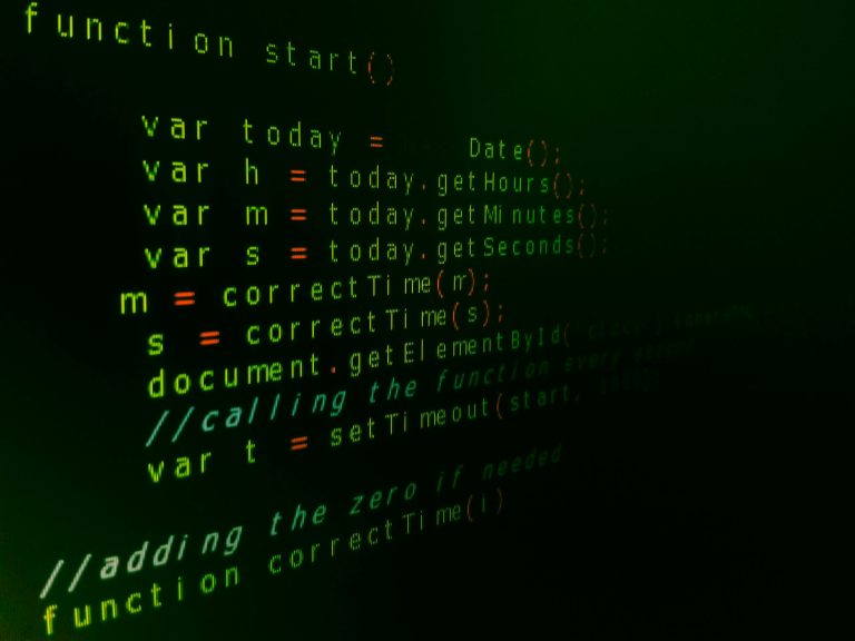 Close-up of JavaScript code on a computer screen with green text highlighting syntax.